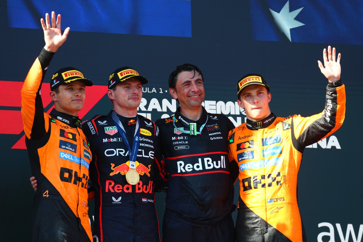 Race winner Max Verstappen of the Netherlands and Oracle Red Bull Racing Second placed Lando Norris of Great Britain and McLaren Third placed Oscar Piastri of Australia and McLaren and Enrico Balbo, Head of Aerodynamics of Oracle Red Bull Racing on the podium during the F1 Grand Prix of Emilia-Romagna at Autodromo Internazionale Enzo e Dino Ferrari on May 18, 2025 in Imola, Italy. (Photo by Clive Rose/Getty Images) // Getty Images / Red Bull Content Pool //