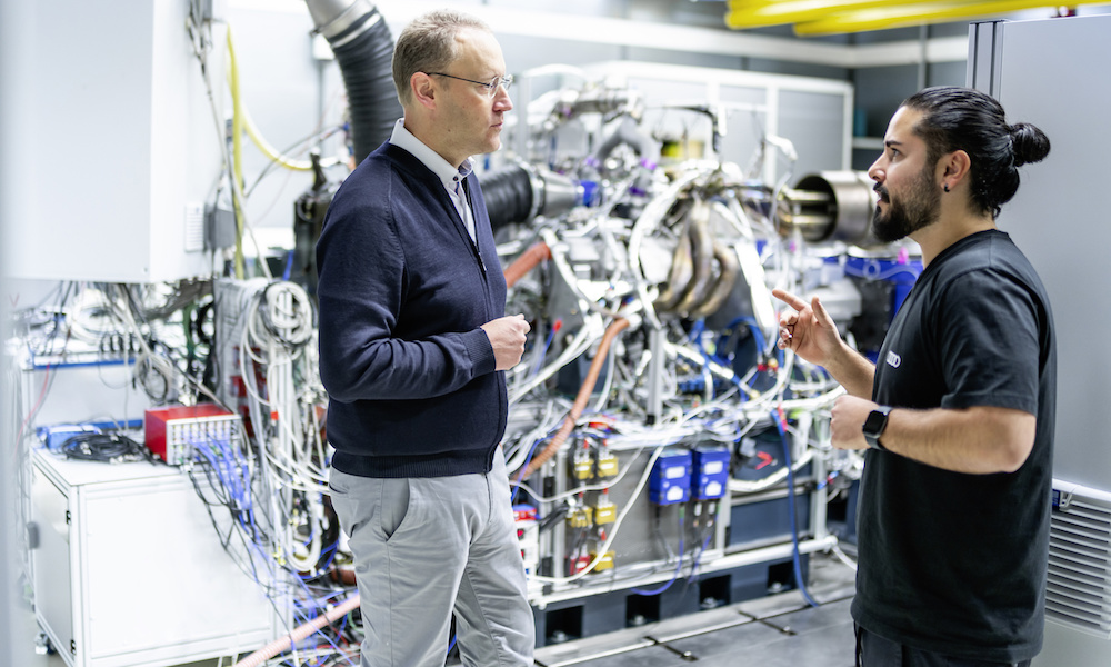 Audi F1 Dyno Room. Stefan Dreyer (left) in conversation at the test bench. Image courtesy of Audi