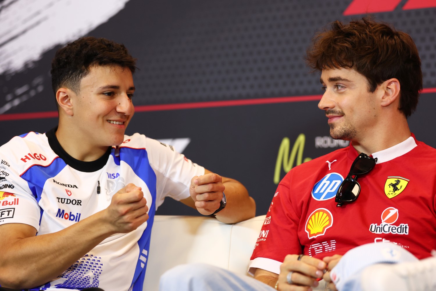 Isack Hadjar of France and Visa Cash App Racing Bulls and Charles Leclerc of Monaco and Scuderia Ferrari talk in the Drivers Press Conference during previews ahead of the F1 GP of Monaco at Circuit de Monaco on May 22, 2025 in Monte-Carlo, Monaco. (Photo by Clive Rose/Getty Images) // Getty Images / Red Bull Content Pool //