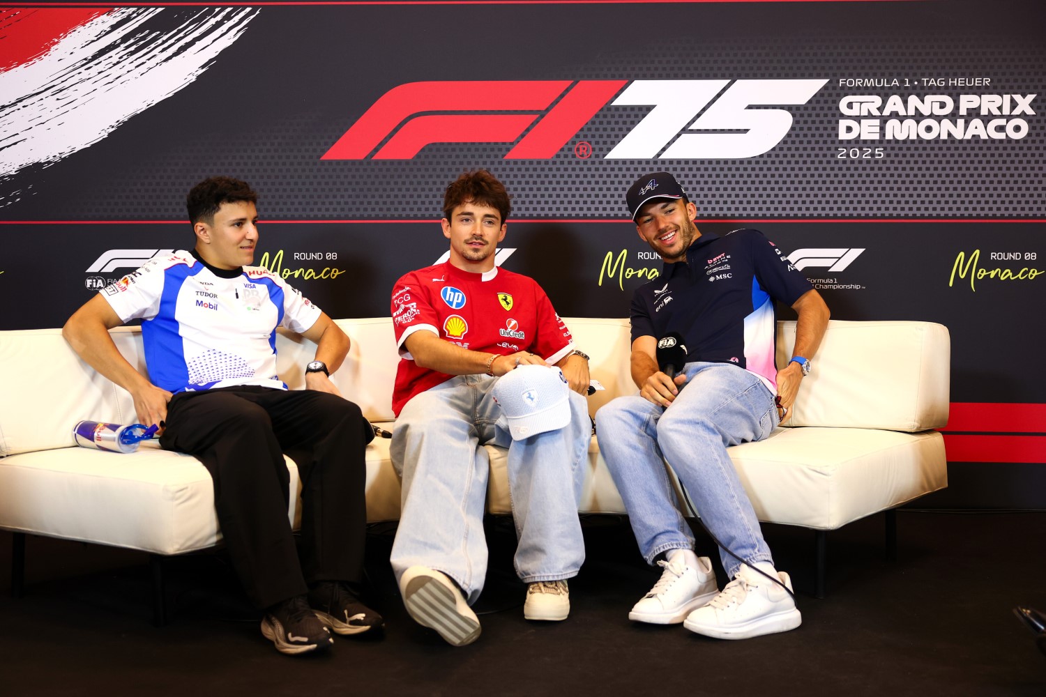 Isack Hadjar of France and Visa Cash App Racing Bulls, Charles Leclerc of Monaco and Scuderia Ferrari, and Pierre Gasly of France and Alpine F1 in the Drivers Press Conference during previews ahead of the F1 GP of Monaco at Circuit de Monaco on May 22, 2025 in Monte-Carlo, Monaco. (Photo by Clive Rose/Getty Images) // Getty Images / Red Bull Content Pool //