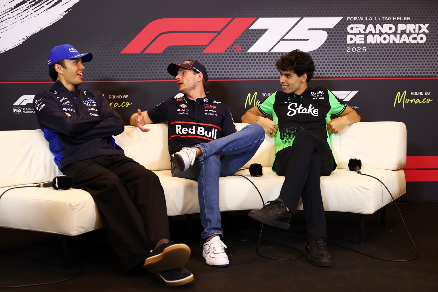 Alexander Albon of Thailand and Williams, Max Verstappen of the Netherlands and Oracle Red Bull Racing and Gabriel Bortoleto of Brazil and Stake F1 Team Kick Sauber talk in the Drivers Press Conference during previews ahead of the F1 GP of Monaco at Circuit de Monaco on May 22, 2025 in Monte-Carlo, Monaco. (Photo by Clive Rose/Getty Images) // Getty Images / Red Bull Content Pool //
