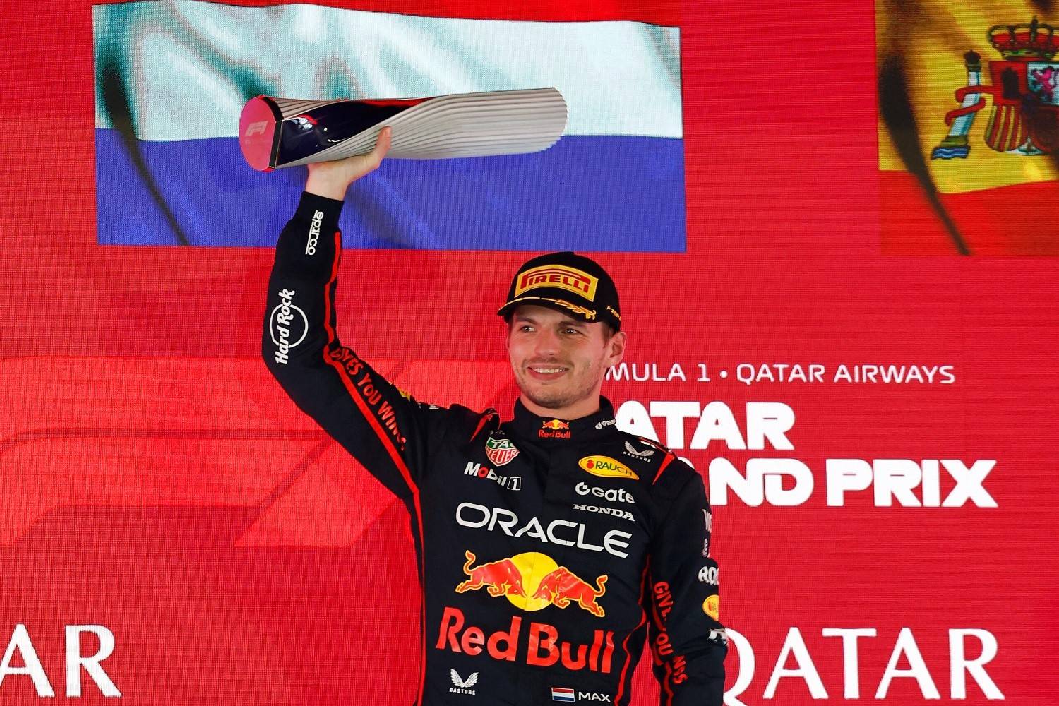 Race winner Max Verstappen of the Netherlands and Oracle Red Bull Racing lifts his trophy on the podium during the F1 Grand Prix of Qatar at Lusail International Circuit on November 30, 2025 in Lusail City, Qatar. (Photo by Andrew Ferraro/LAT Images) // Getty Images / Red Bull Content Pool // 