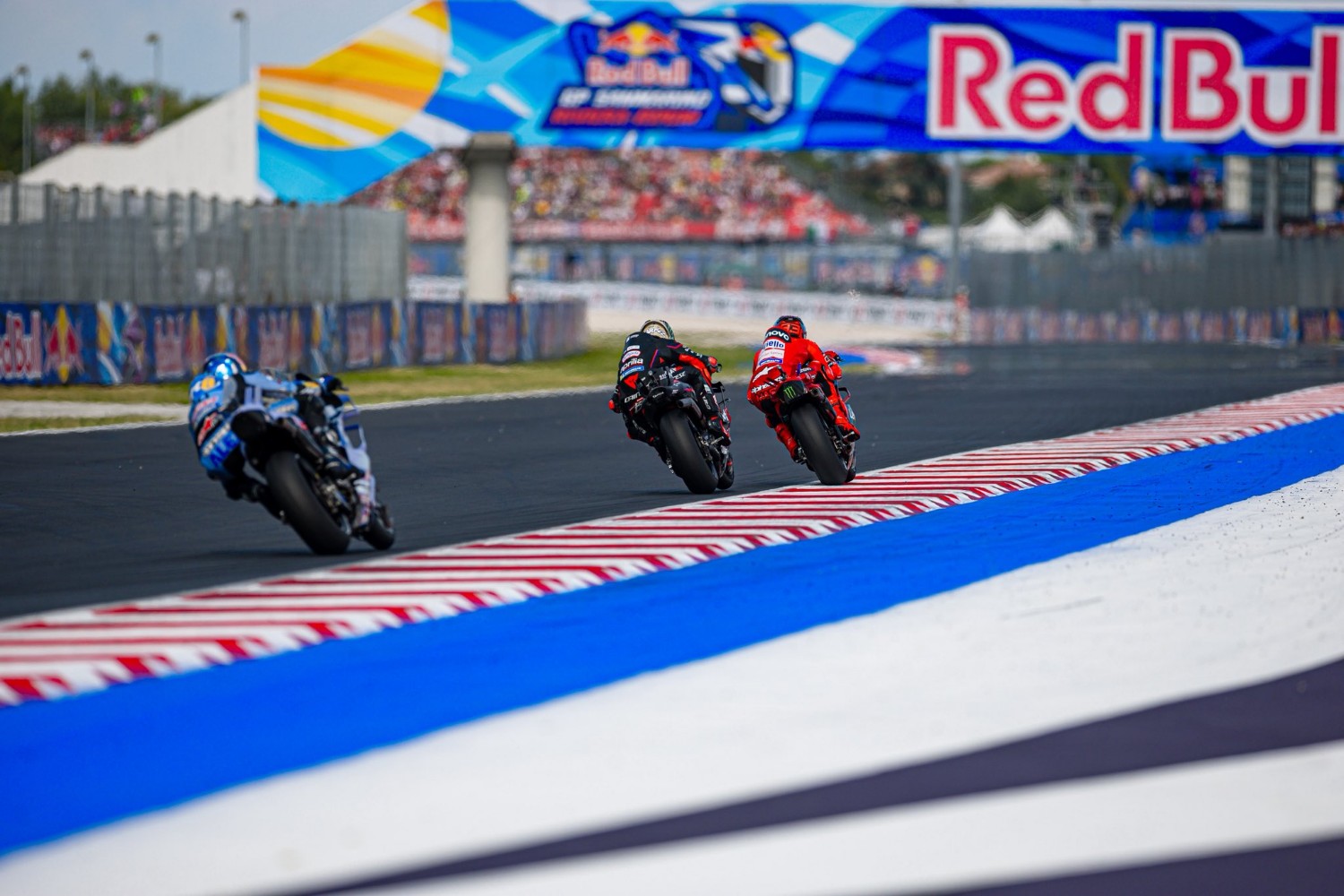 Marc Marquez holds off Marco Bezzecchi