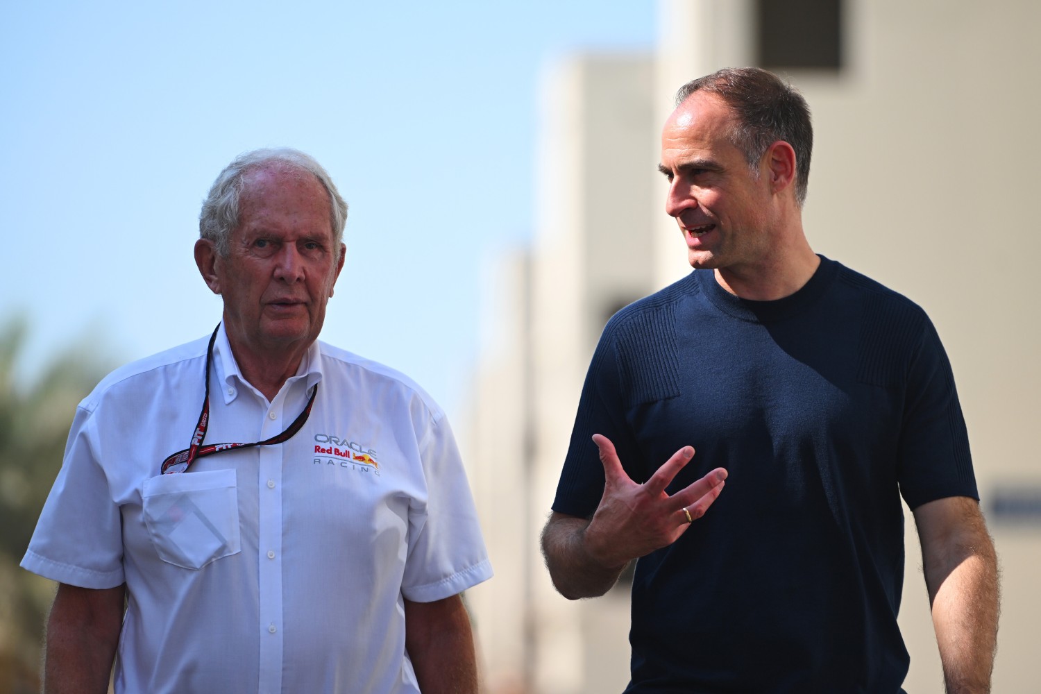 Dr Helmut Marko, Team Consultant of Oracle Red Bull Racing and Oliver Mintzlaff, Managing director of Red Bull GmbH, talk as they walk in the Paddock prior to the F1 Grand Prix of Abu Dhabi at Yas Marina Circuit on December 07, 2025 in Abu Dhabi, United Arab Emirates. (Photo by Rudy Carezzevoli/Getty Images) // Getty Images / Red Bull Content Pool