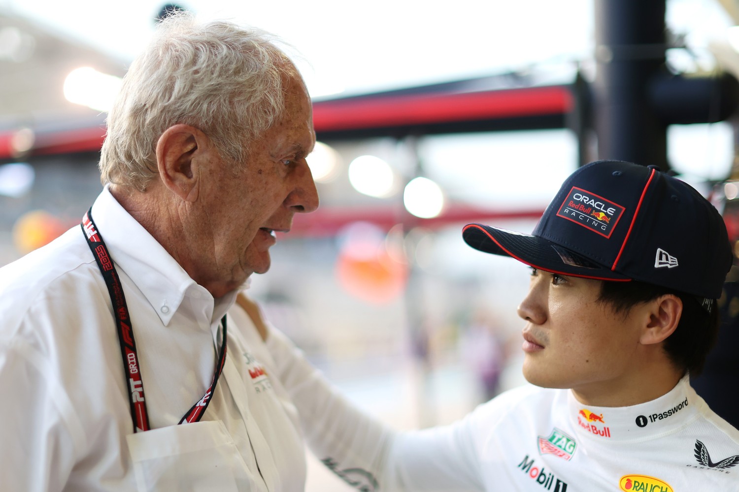 Dr Helmut Marko, Team Consultant of Oracle Red Bull Racing talks with Yuki Tsunoda of Japan and Oracle Red Bull Racing in the Pitlane during practice ahead of the F1 Grand Prix of Bahrain at Bahrain International Circuit on April 11, 2025 in Bahrain, Bahrain. (Photo by Mark Thompson/Getty Images) // Getty Images / Red Bull Content Pool //