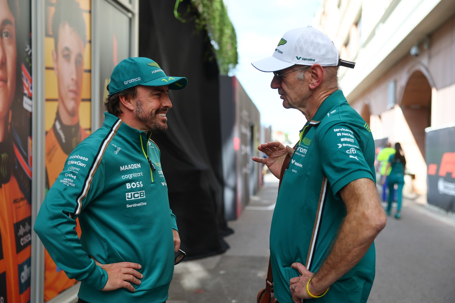 Fernando Alonso of Spain and Aston Martin F1 Team and Adrian Newey, Managing Technical Partner of Aston Martin F1 talk in the Paddock during previews ahead of the F1 Grand Prix of Monaco at Circuit de Monaco on May 22, 2025 in Monte-Carlo, Monaco. (Photo by Zak Mauger/LAT Images for Aston Martin)