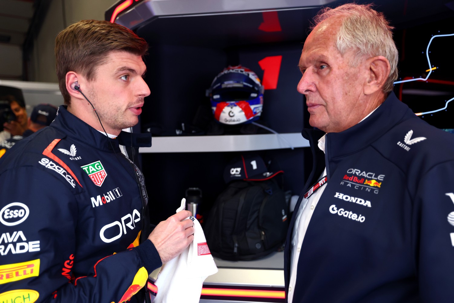 Max Verstappen of the Netherlands and Oracle Red Bull Racing and Dr Helmut Marko, Team Consultant of Oracle Red Bull Racing talk in the Paddock prior to the F1 Grand Prix of Emilia-Romagna at Autodromo Internazionale Enzo e Dino Ferrari on May 18, 2025 in Imola, Italy. (Photo by Mark Thompson/Getty Images) // Getty Images / Red Bull Content Pool //