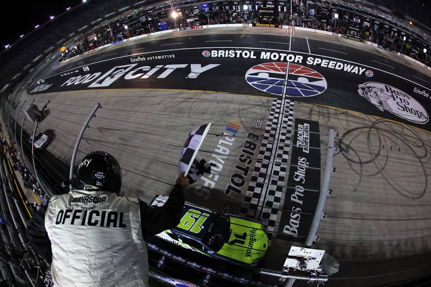 Aric Almirola, driver of the #19 Young Life Toyota, takes the checkered flag to win the NASCAR Xfinity Series Food City 300 at Bristol Motor Speedway on September 12, 2025 in Bristol, Tennessee. (Photo by Jonathan Bachman/Getty Images for NASCAR)