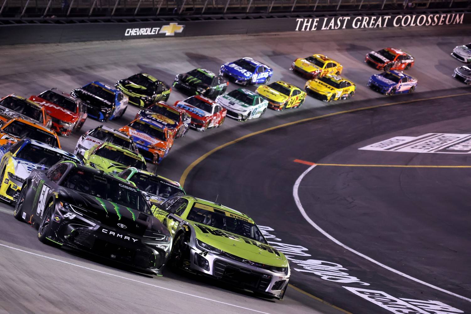 Ty Gibbs, driver of the #54 Monster Energy Toyota, and William Byron, driver of the #24 Raptor Chevrolet, lead the field during the NASCAR Cup Series Bass Pro Shops Night Race at Bristol Motor Speedway on September 13, 2025 in Bristol, Tennessee. (Photo by Jonathan Bachman/Getty Images)