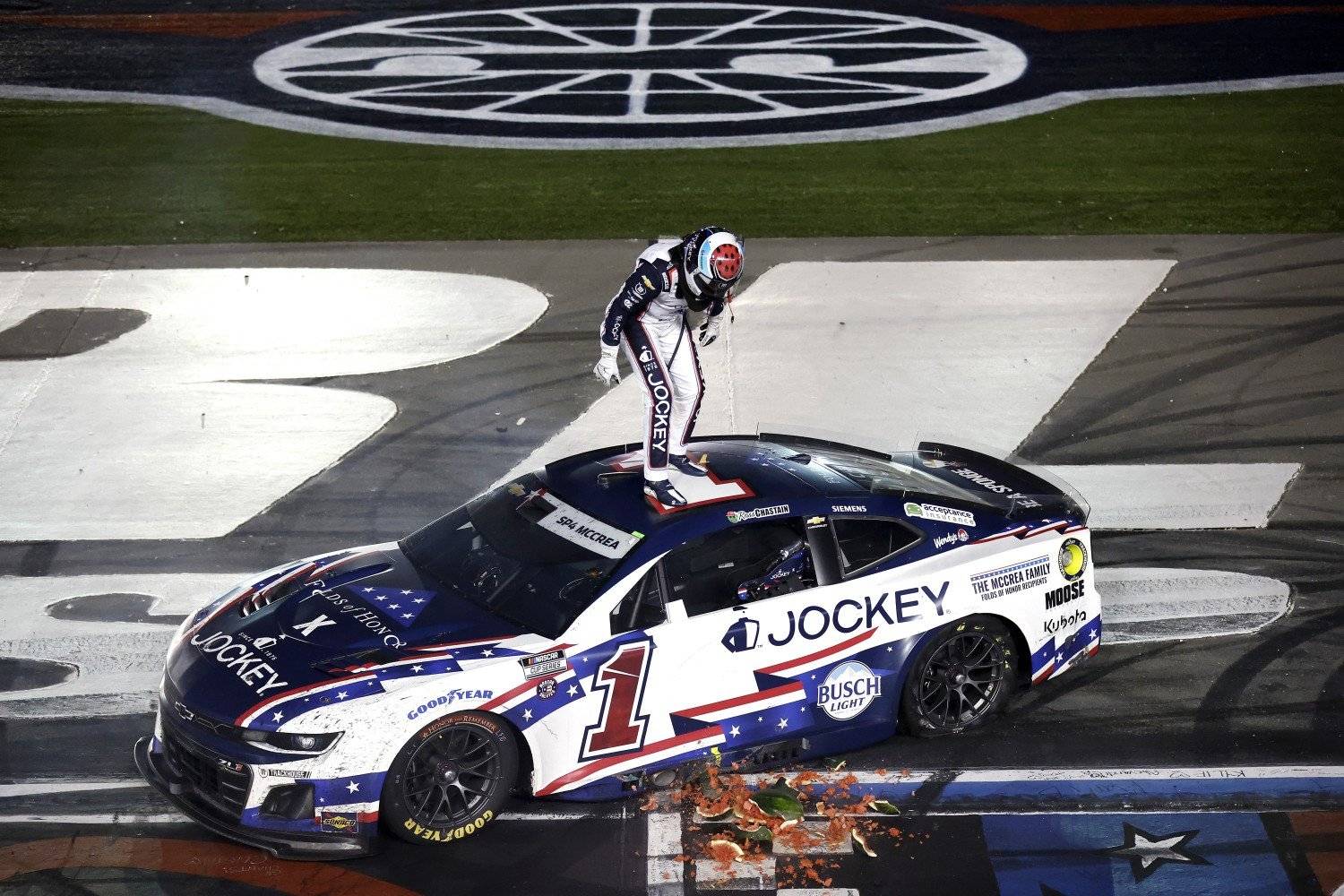Ross Chastain, driver of the #1 Jockey x Folds of Honor Chevrolet, celebrates by smashing a watermelon after winning the NASCAR Cup Series Coca-Cola 600 at Charlotte Motor Speedway on May 25, 2025 in Concord, North Carolina. (Photo by Logan Riely/Getty Images for NASCAR)