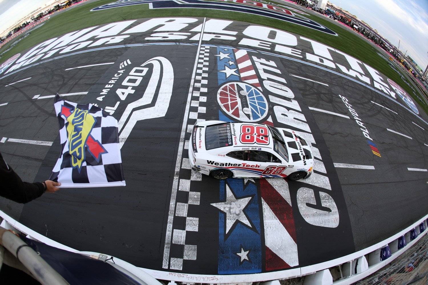 Shane Van Gisbergen, driver of the #88 WeatherTech Chevrolet, takes the checkered flag to win the NASCAR Cup Series Bank of America ROVAL 400 at Charlotte Motor Speedway on October 05, 2025 in Concord, North Carolina. (Photo by David Jensen/Getty Images for NASCAR)