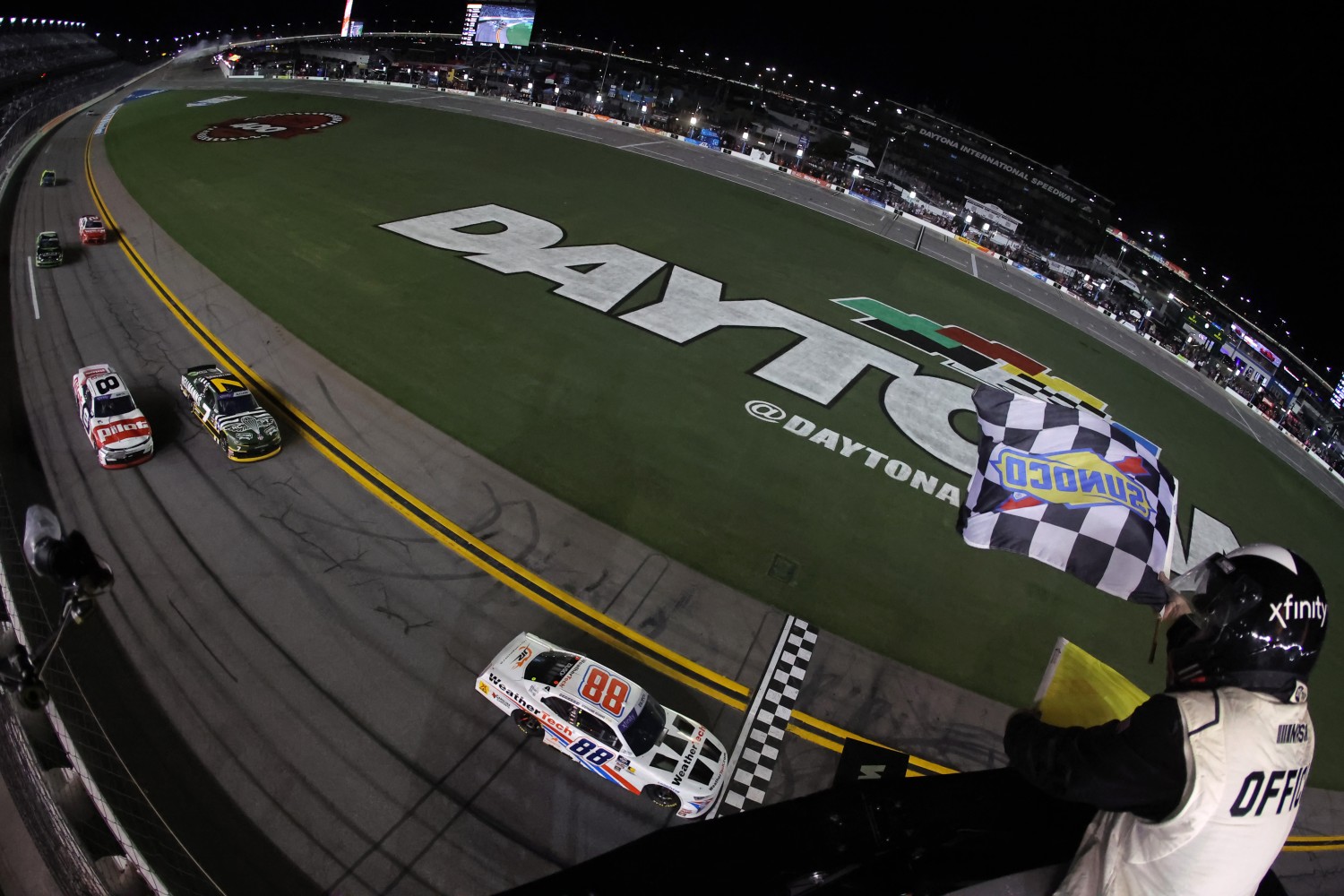 Parker Kligerman, driver of the #88 WeatherTech Chevrolet, takes the checkered flag to win the NASCAR Xfinity Series Wawa 250 Powered By Coca-Cola at Daytona International Speedway on August 22, 2025 in Daytona Beach, Florida. (Photo by Jonathan Bachman/Getty Images for NASCAR)
