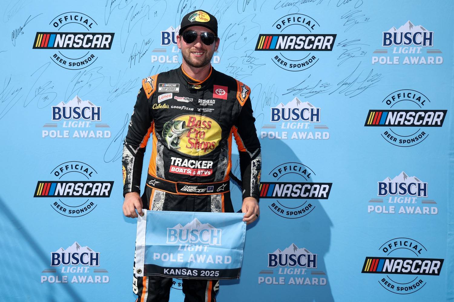 Chase Briscoe, driver of the #19 Bass Pro Shops Toyota, poses for photos after winning the pole award during qualifying for the NASCAR Cup Series Hollywood Casino 400 Presented by ESPN BET at Kansas Speedway on September 27, 2025 in Kansas City, Kansas. (Photo by Chris Graythen/Getty Images for NASCAR)