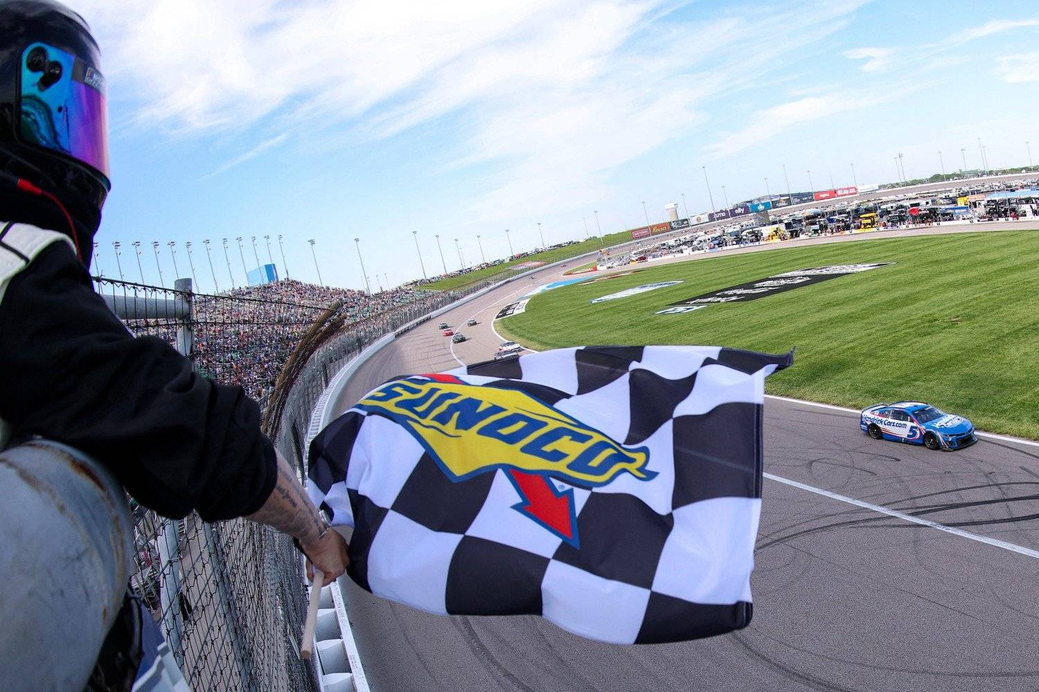 Kyle Larson, driver of the #5 HendrickCars.com Chevrolet, takes the checkered flag to win the NASCAR Cup Series AdventHealth 400 at Kansas Speedway on May 11, 2025 in Kansas City, Kansas. (Photo by Jamie Squire/Getty Images)