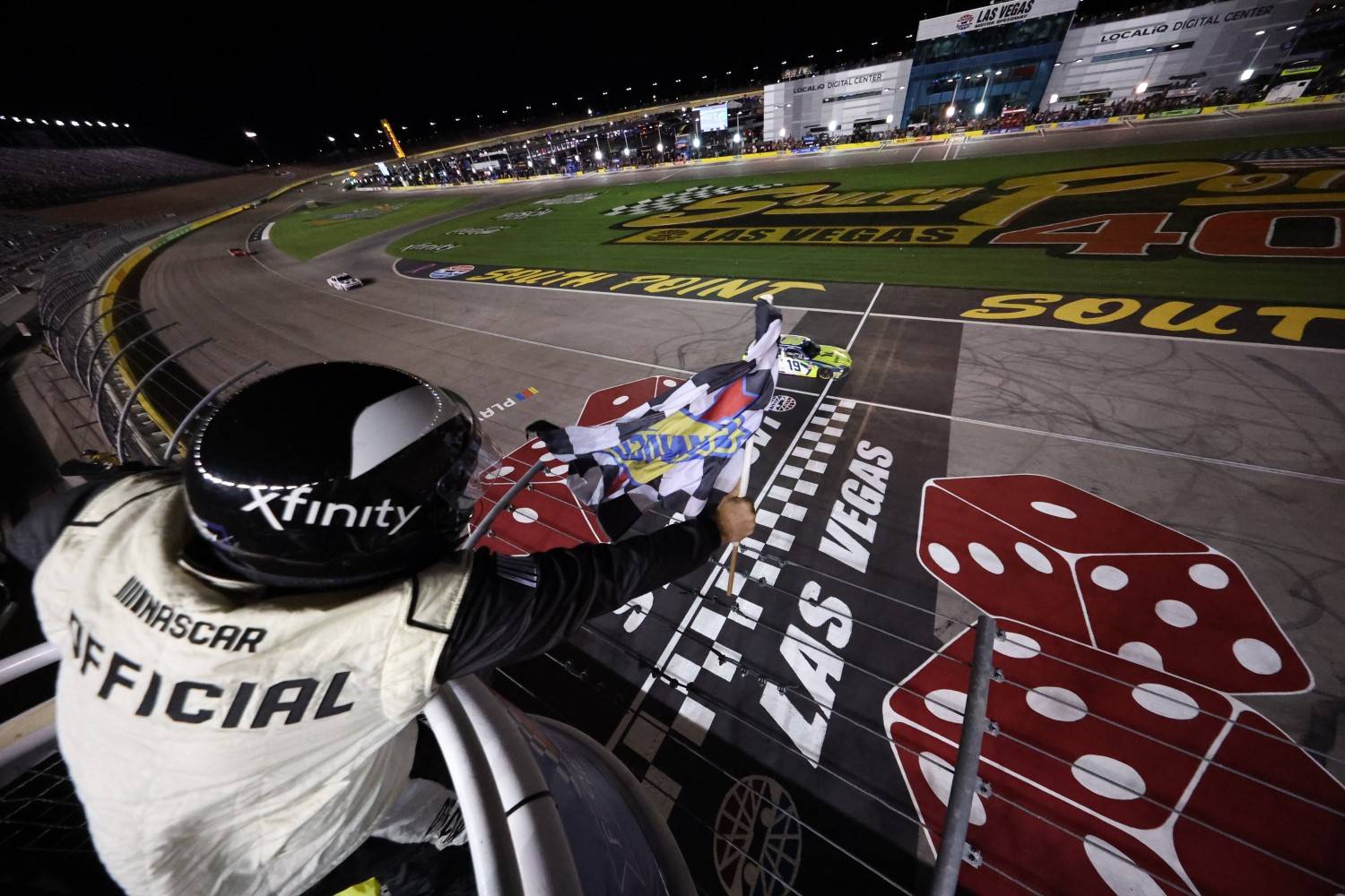 Aric Almirola, driver of the #19 Young Life Toyota, takes the checkered flag to win the NASCAR Xfinity SeriesFocused Health 302 at Las Vegas Motor Speedway on October 11, 2025 in Las Vegas, Nevada. (Photo by Chris Graythen/Getty Images for NASCAR)