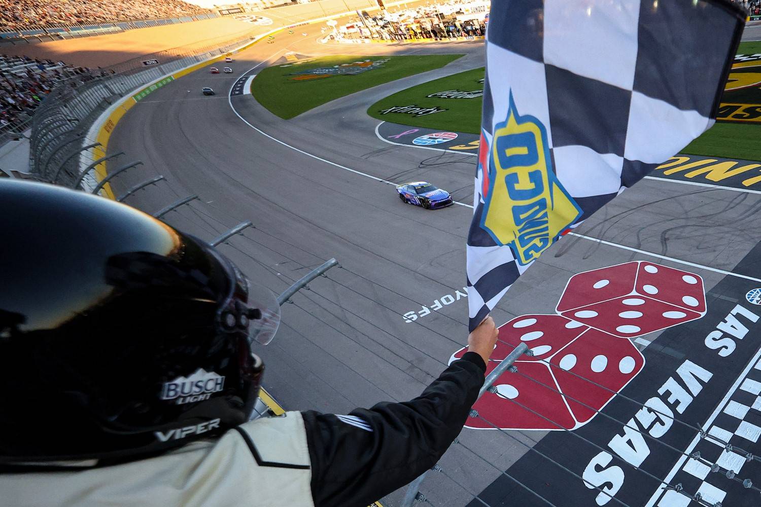 Denny Hamlin, driver of the #11 ampm Toyota, takes the checkered flag to win the NASCAR Cup Series South Point 400 at Las Vegas Motor Speedway on October 12, 2025 in Las Vegas, Nevada. (Photo by Chris Graythen/Getty Images for NASCAR)
