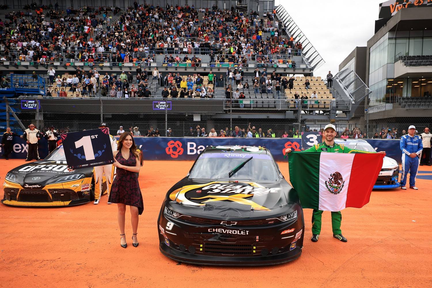 Daniel Suarez, driver of the #9 Quaker State Chevrolet, celebrates with the Mexican flag after winning the NASCAR Xfinity Series The Chilango 150 at Autodromo Hermanos Rodriguez on June 14, 2025 in Mexico City, Mexico. (Photo by Chris Graythen/Getty Images)