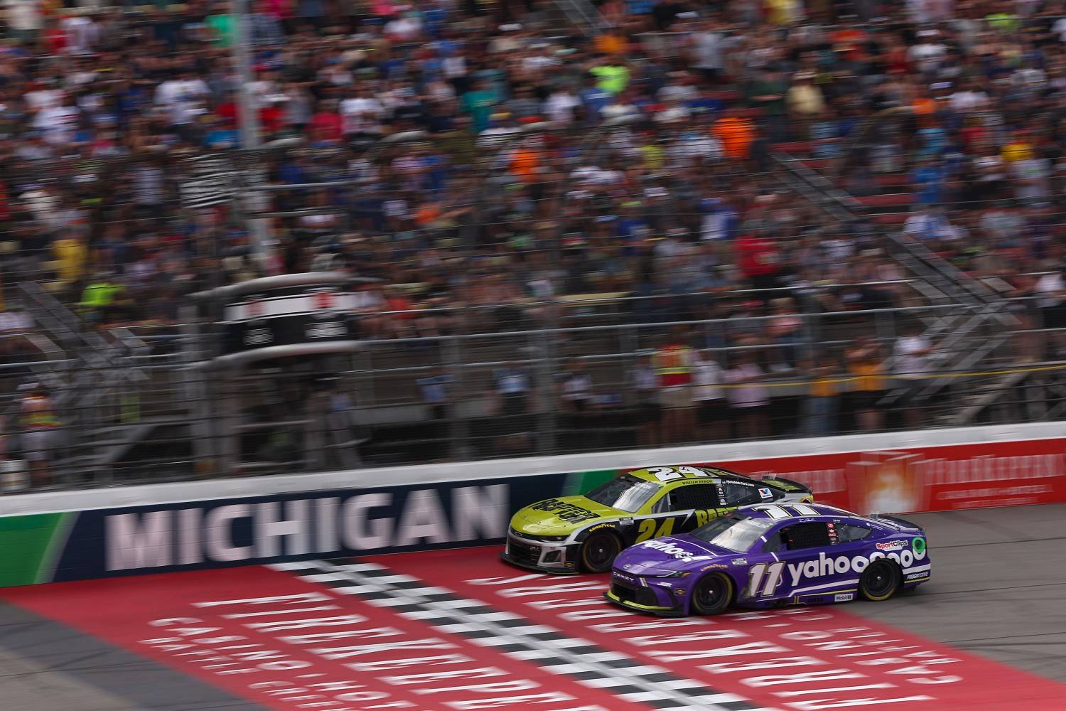 Denny Hamlin, driver of the #11 Yahoo! Toyota, and William Byron, driver of the #24 Raptor Chevrolet, race during the NASCAR Cup Series FireKeepers Casino 400 at Michigan International Speedway on June 08, 2025 in Brooklyn, Michigan. (Photo by Meg Oliphant/Getty Images for NASCAR)