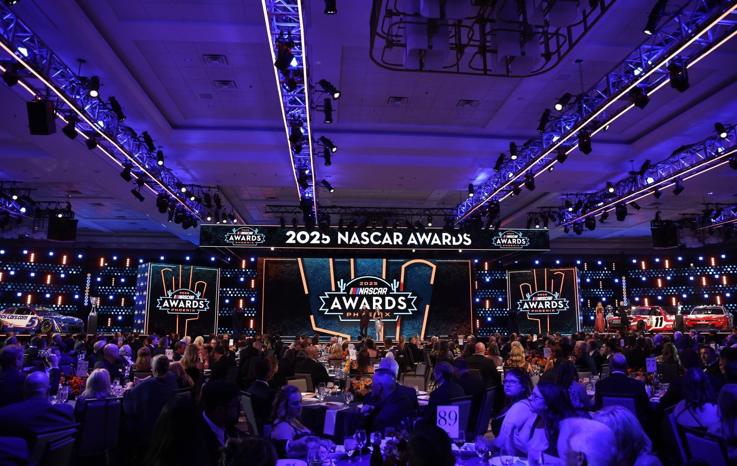Host Adam Alexander and Kim Coon onstage to open the 2025 NASCAR Awards Show at JW Marriott Desert Ridge Resort & Spa on November 04, 2025 in Phoenix, Arizona. (Photo by Sean Gardner/Getty Images for NASCAR)