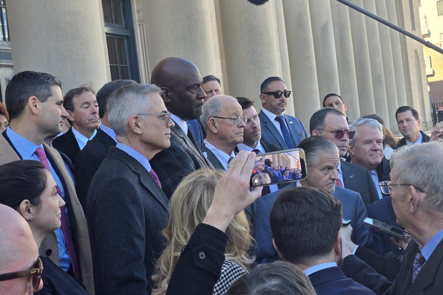 Press Conference on steps of courthouse. Antitrust lawsuit settled out of court