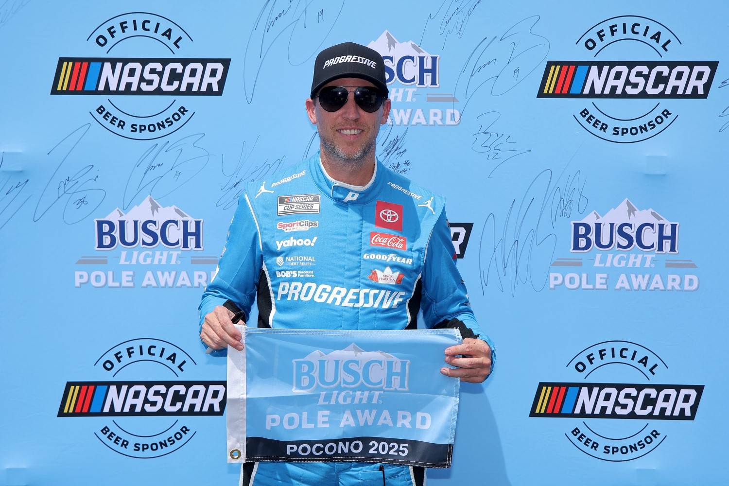 Denny Hamlin, driver of the #11 Progressive Toyota, poses for photos after winning the pole award during qualifying for the NASCAR Cup Series The Great American Getaway 400 at Pocono Raceway on June 21, 2025 in Long Pond, Pennsylvania. (Photo by Jonathan Bachman/Getty Images)