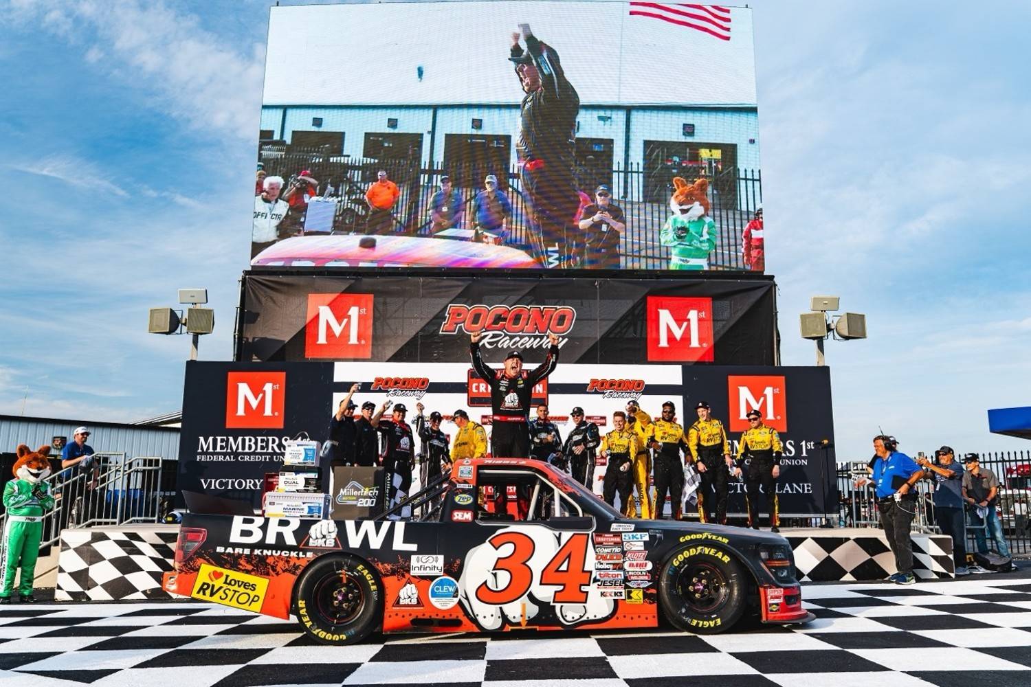 Front Row Motorsports driver Layne Riggs celebrates in Victory Lane after winning Friday’s MillerTech Battery 200 NASCAR CRAFTSMAN Truck Series race at Pocono Raceway.. Photo credit: Dan Ryan / Pocono Raceway.