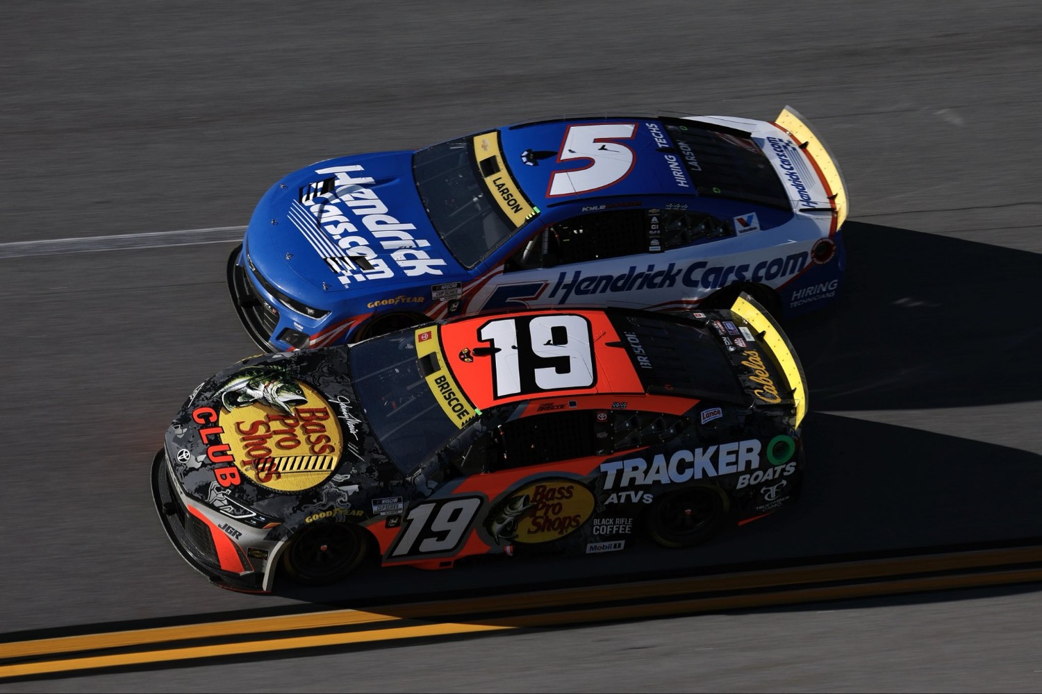 No. 19 race winner Chase Briscoe battles Kyle Larson. Briscoe won the YellaWood 500 while Larson ran out of fuel on the last lap.
