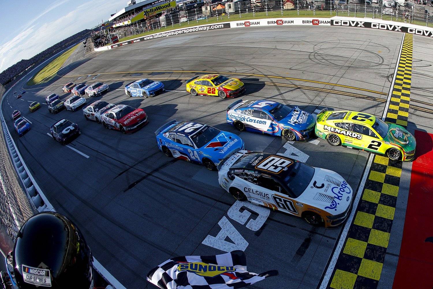 Austin Cindric, driver of the #2 Menards/Quaker State Ford, takes the checkered flag to win the NASCAR Cup Series Jack Link's 500 at Talladega Superspeedway on April 27, 2025 in Talladega, Alabama. (Photo by Logan Riely/Getty Images for NASCAR)