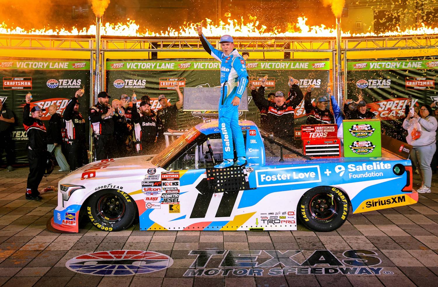 Corey Heim, driver of the #11 Safelite/Foster Love Toyota, celebrates in victory lane after winning the NASCAR Craftsman Truck Series SpeedyCash.com 250 at Texas Motor Speedway on May 02, 2025 in Fort Worth, Texas. (Photo by Chris Graythen/Getty Images for NASCAR)