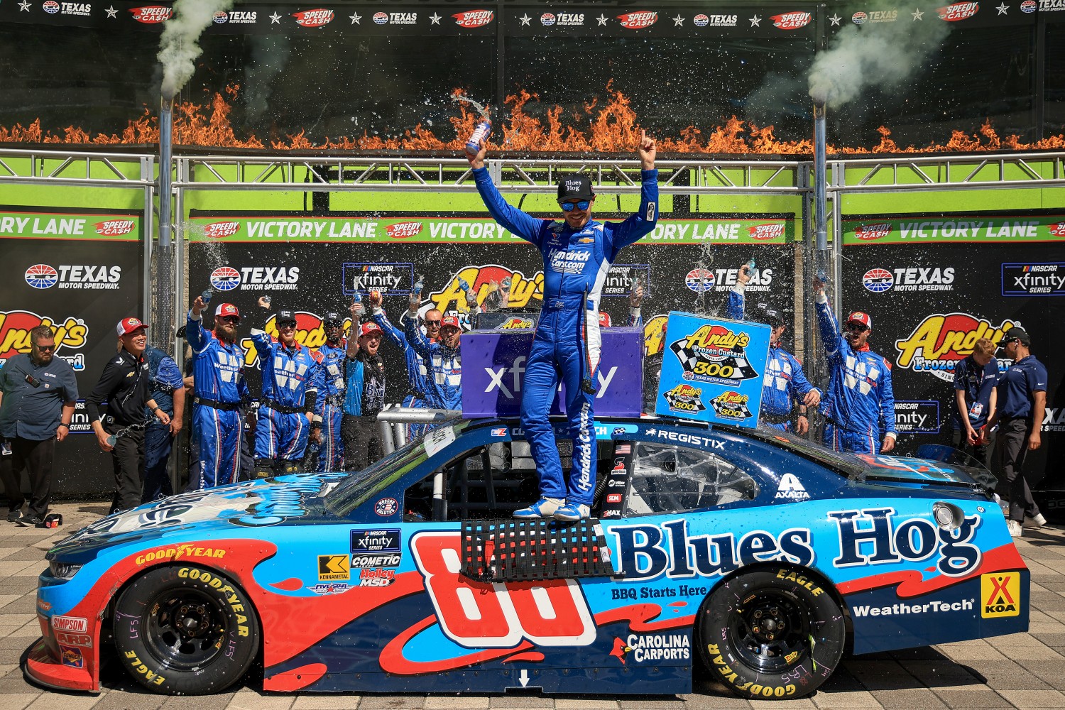 Kyle Larson, driver of the #88 Blues Hog Chevrolet, celebrates in victory lane after winning the NASCAR Xfinity Series Andy's Frozen Custard 300 at Texas Motor Speedway on May 03, 2025 in Fort Worth, Texas. (Photo by Chris Graythen/Getty Images)