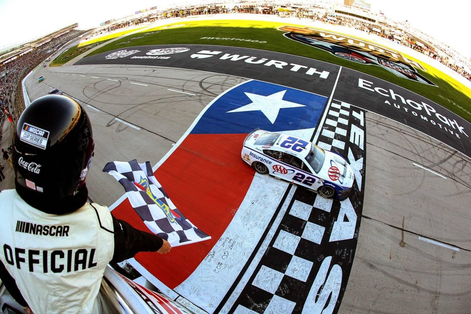 Joey Logano, driver of the #22 AAA Insurance Ford, takes the checkered flag to win the NASCAR Cup Series Würth 400 at Texas Motor Speedway on May 04, 2025 in Fort Worth, Texas. (Photo by James Gilbert/Getty Images)