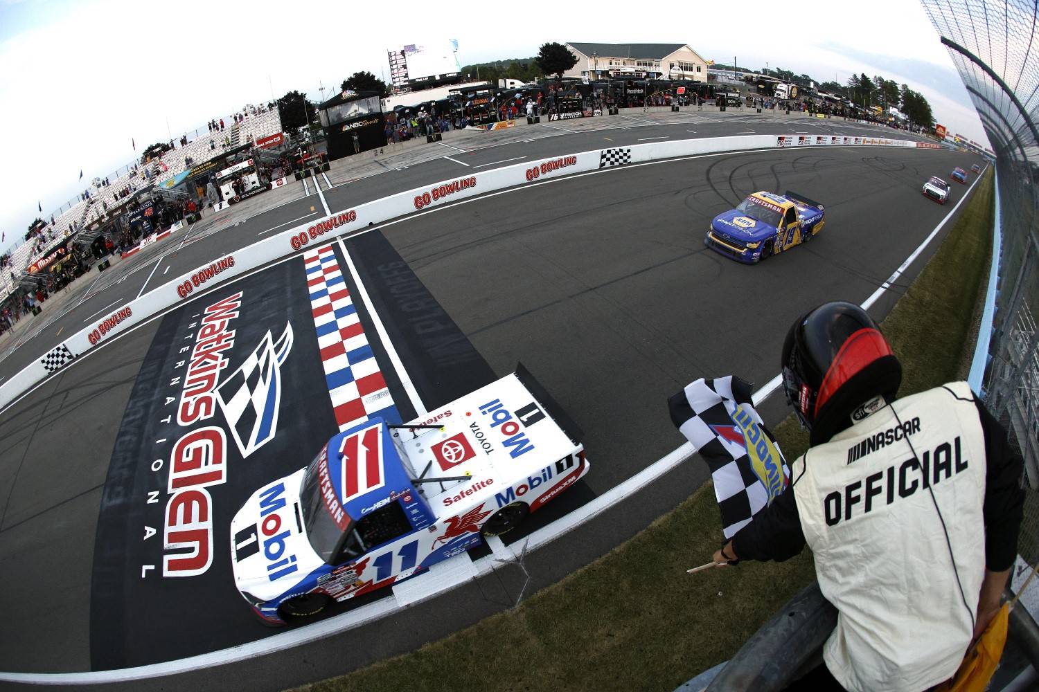 Corey Heim, driver of the #11 Mobil 1 Toyota, takes the checkered flag to win the NASCAR Craftsman Truck Series Mission 176 at The Glen at Watkins Glen International on August 08, 2025 in Watkins Glen, New York. (Photo by Sean Gardner/Getty Images)