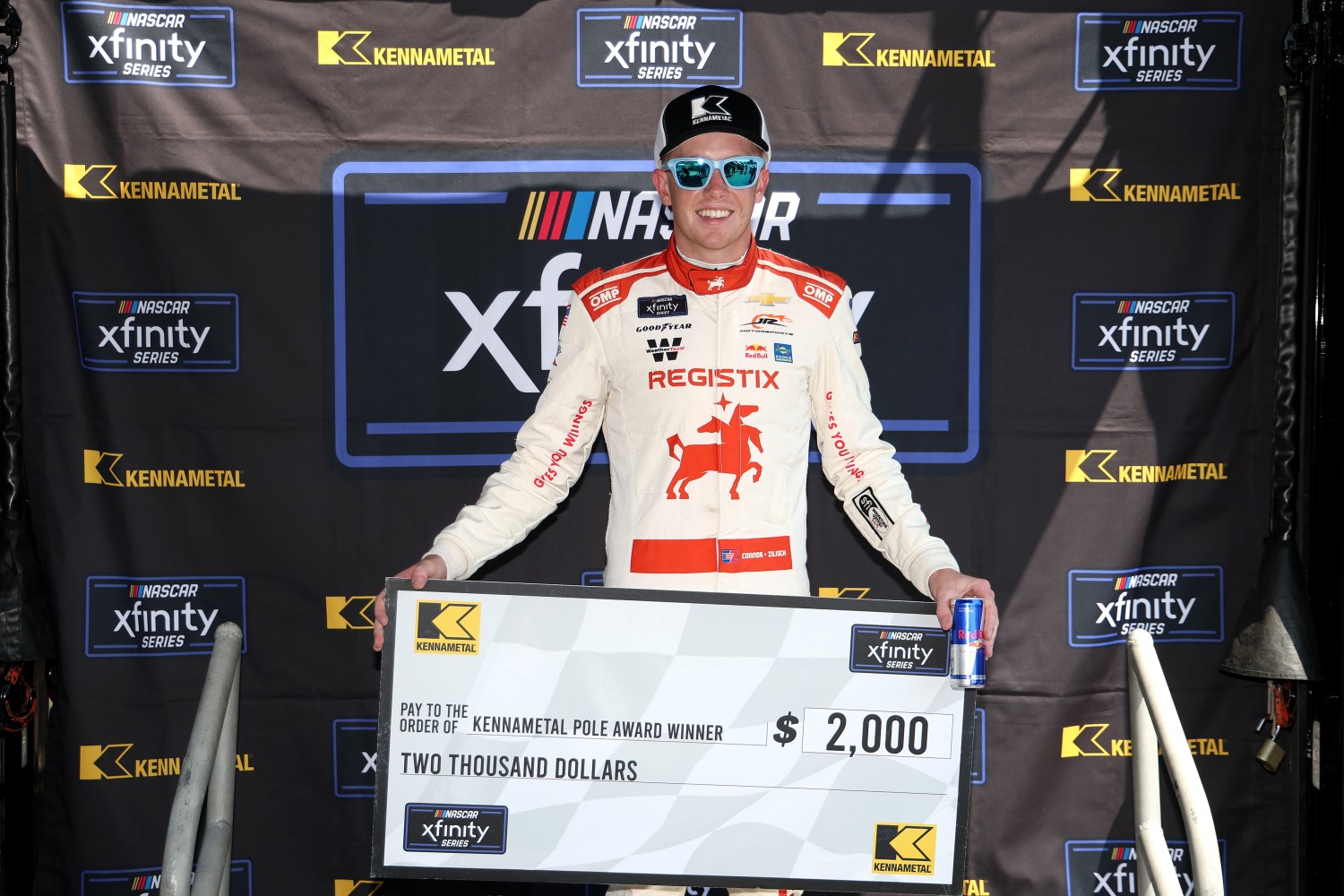 Connor Zilisch, driver of the #88 Registix Chevrolet, poses with the pole award winner $2,00.00 check during qualifying for the NASCAR Xfinity Series Mission 200 at The Glen at Watkins Glen International on August 09, 2025 in Watkins Glen, New York. (Photo by Chris Graythen/Getty Images)