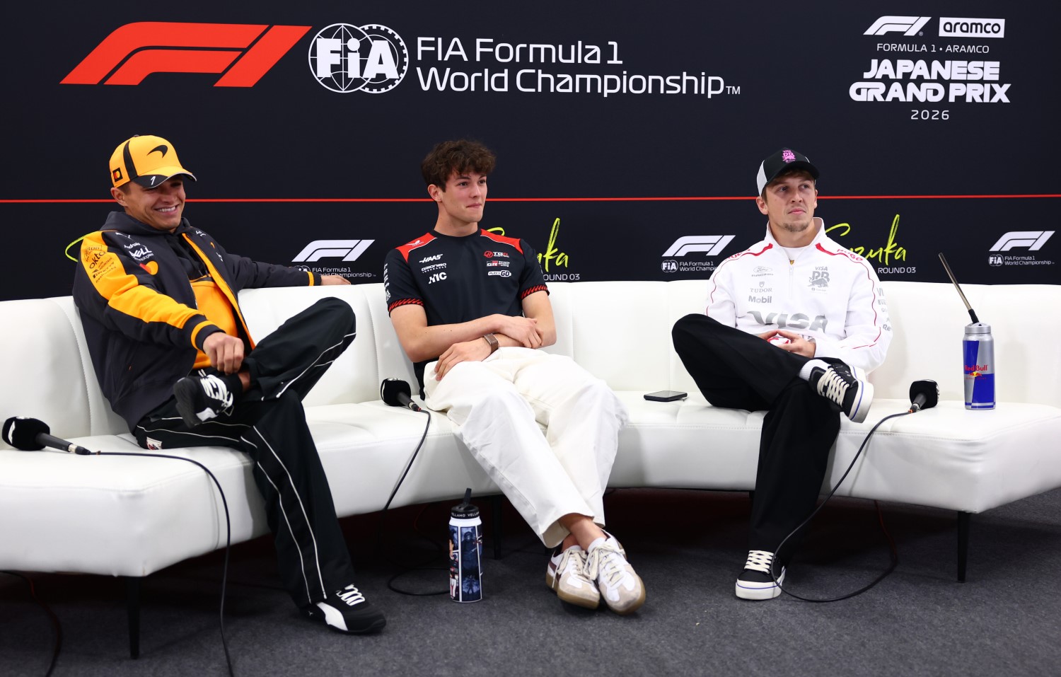 Lando Norris of Great Britain and McLaren, Oliver Bearman of Great Britain and Haas F1 and Liam Lawson of New Zealand and Visa Cash App Racing Bulls attend the Drivers Press Conference during previews ahead of the F1 Japanese GP at Suzuka Circuit on March 26, 2026 in Suzuka, Japan. (Photo by Clive Rose/Getty Images) // Getty Images / Red Bull Content Pool //