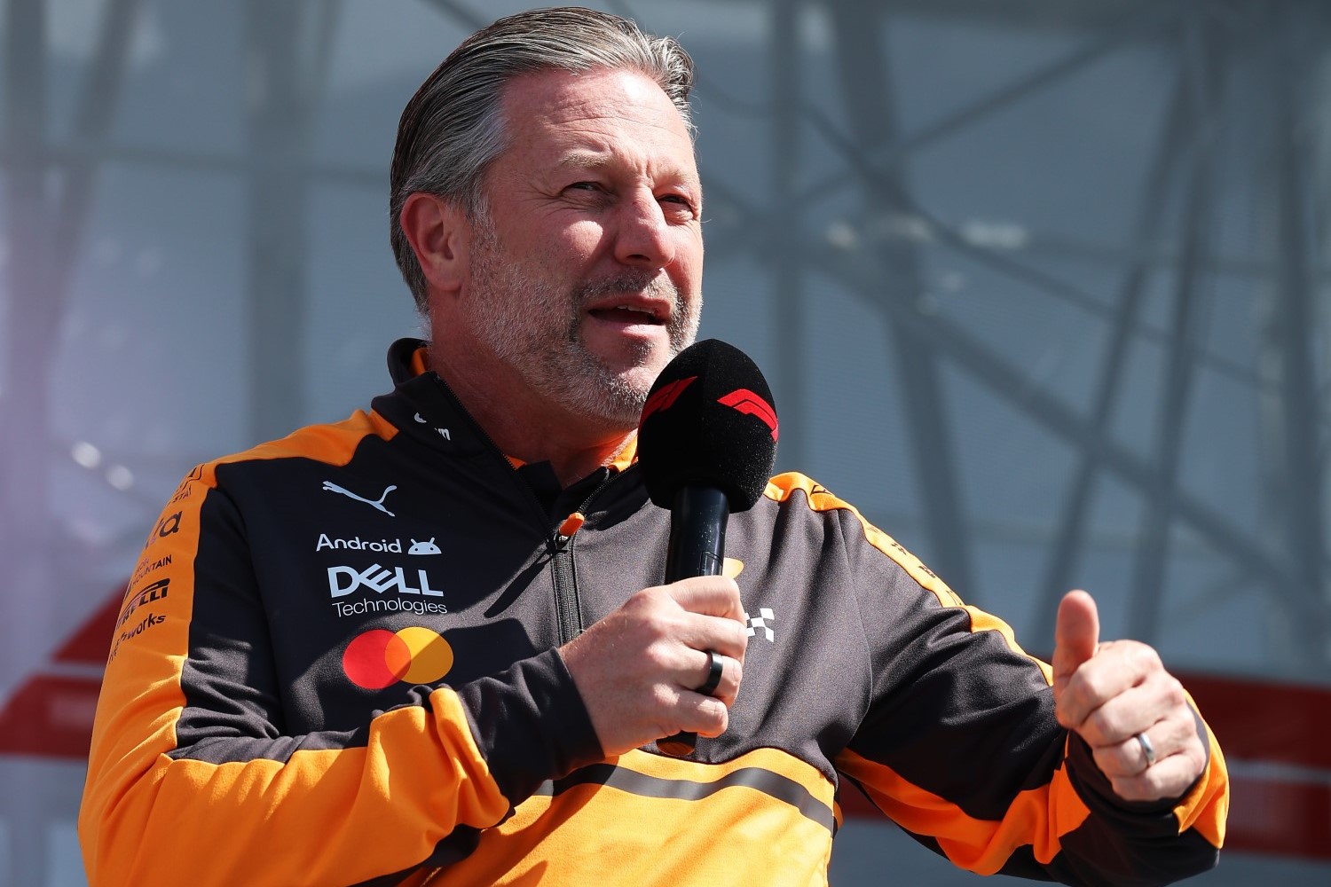 Zak Brown, Chief Executive Officer of McLaren talks to the crowd on the fan stage during practice ahead of the F1 Grand Prix of Japan at Suzuka Circuit on March 27, 2026 in Suzuka, Japan. (Photo by Steven Tee/LAT Images for McLaren)