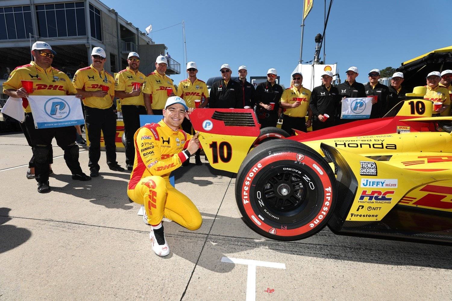 Alex Palou celebrates winning pole position