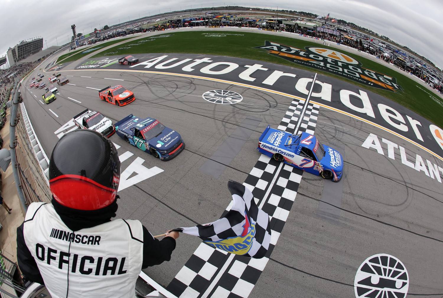 Kyle Busch, driver of the #7 HendrickCars.com Chevrolet, takes the checkered flag to win the NASCAR Craftsman Truck Series Fr8 Racing 208 at Echo Park Speedway on February 21, 2026 in Hampton, Georgia. (Photo by Jonathan Bachman/Getty Images)