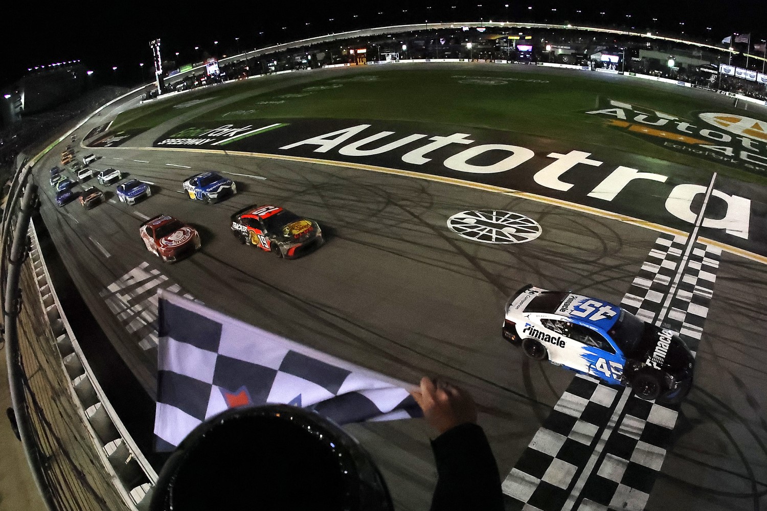 Tyler Reddick, driver of the #45 Pinnacle Toyota, takes the checkered flag to win the NASCAR Cup Series Autotrader 400 at Echo Park Speedway on February 22, 2026 in Hampton, Georgia. (Photo by Jonathan Bachman/Getty Images)