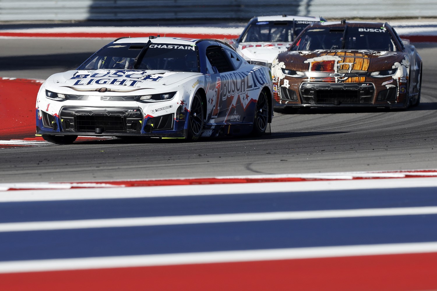 Ross Chastain, driver of the #1 Busch Light Chevrolet, and Kyle Busch, driver of the #8 Rebel Root Beer Whiskey Chevrolet, race during the NASCAR Cup Series DuraMax Grand Prix Powered by RelaDyne at Circuit of The Americas on March 01, 2026 in Austin, Texas. (Photo by Logan Riely/Getty Images)
