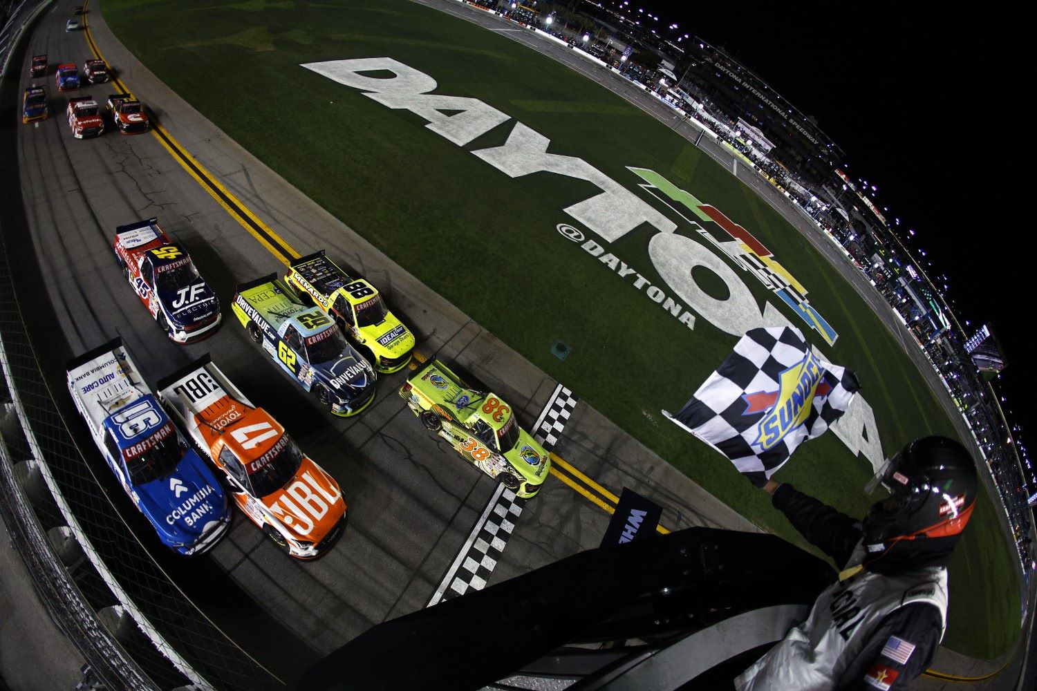 Chandler Smith, driver of the #38 TrophyCatch Ford, takes the checkered flag to win the NASCAR Craftsman Truck Series Fresh from Florida 250 at Daytona International Speedway on February 13, 2026 in Daytona Beach, Florida. (Photo by Sean Gardner/Getty Images)