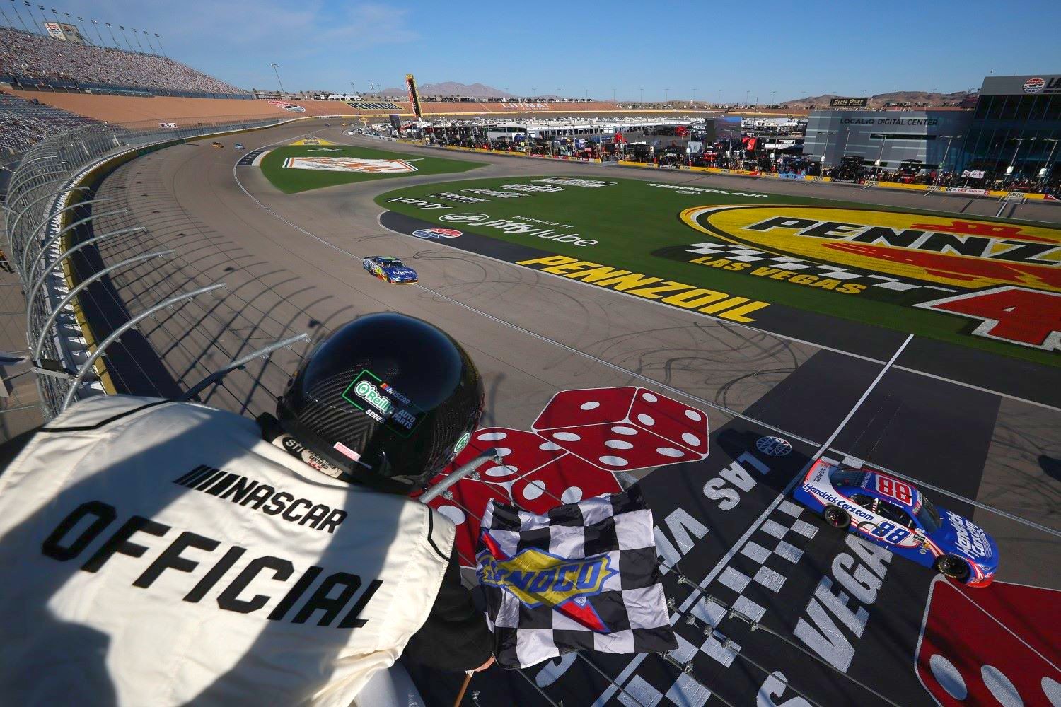 Kyle Larson, driver of the #88 HendrickCars.com Chevrolet, takes the checkered flag to win the NASCAR O'Reilly Auto Parts Series The LiUNA! at Las Vegas Motor Speedway on March 14, 2026 in Las Vegas, Nevada. (Photo by Chris Graythen/Getty Images)