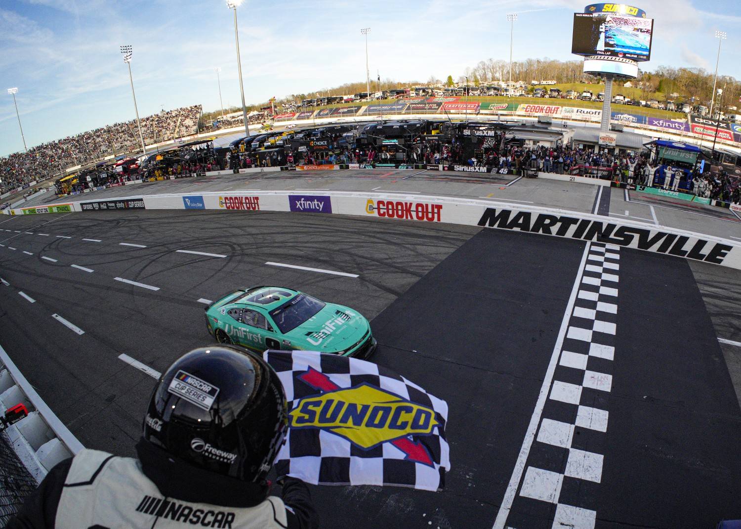 Chase Elliott, driver of the #9 UniFirst Chevrolet, takes the checkered flag to win the NASCAR Cup Series Cook Out 400 at Martinsville Speedway on March 29, 2026 in Martinsville, Virginia. (Photo by Jacob Kupferman/Getty Images)