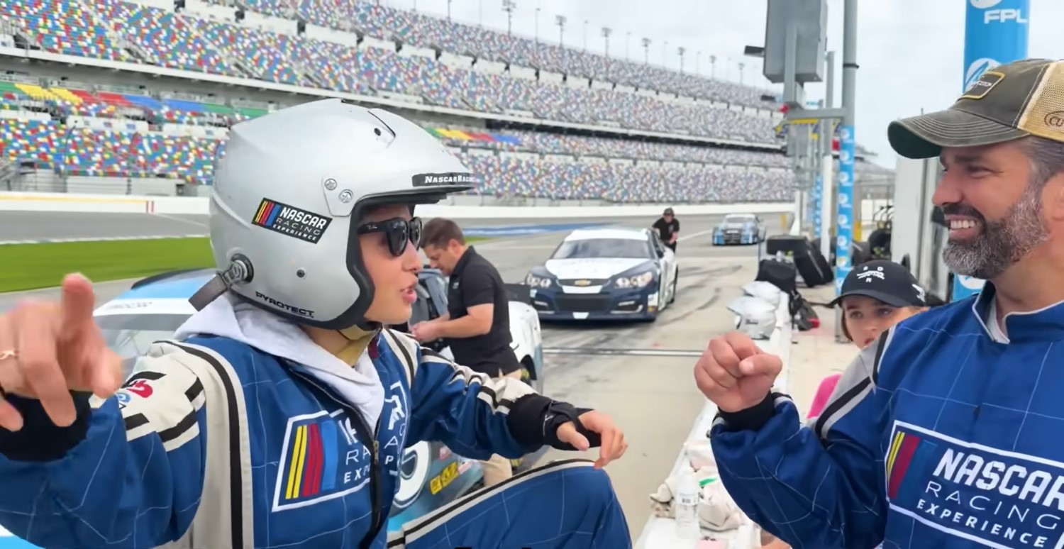 The granddaughter of President Donald Trump, Kai Trump, and Father Don Jr. at Daytona