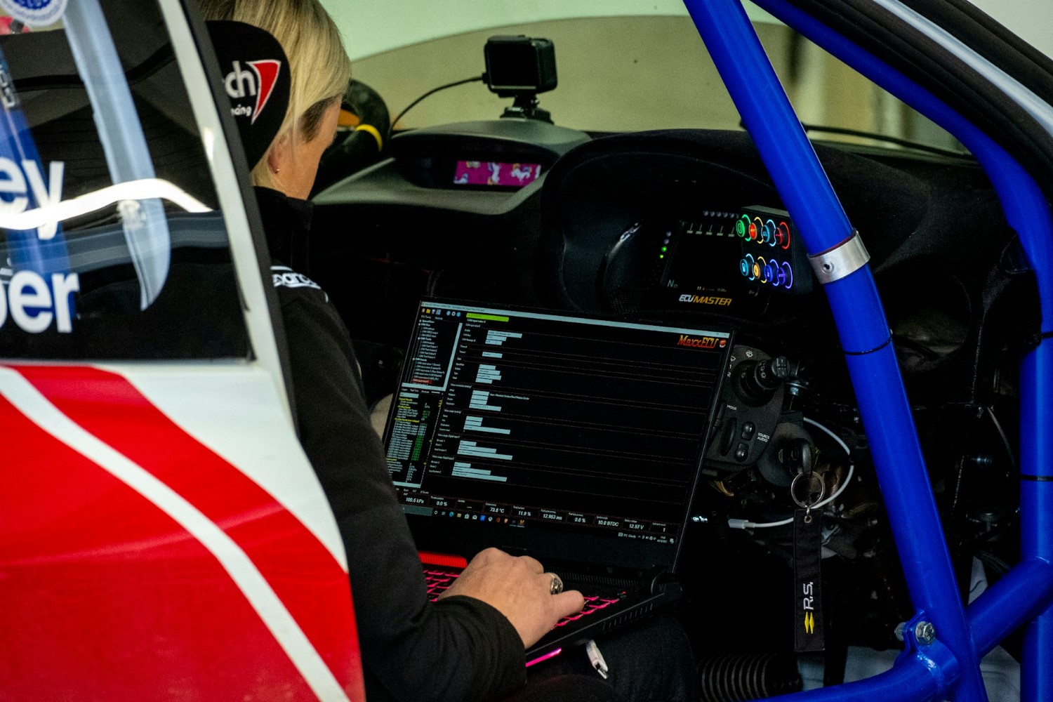 Woman in race car by Jack Plant on Unsplash