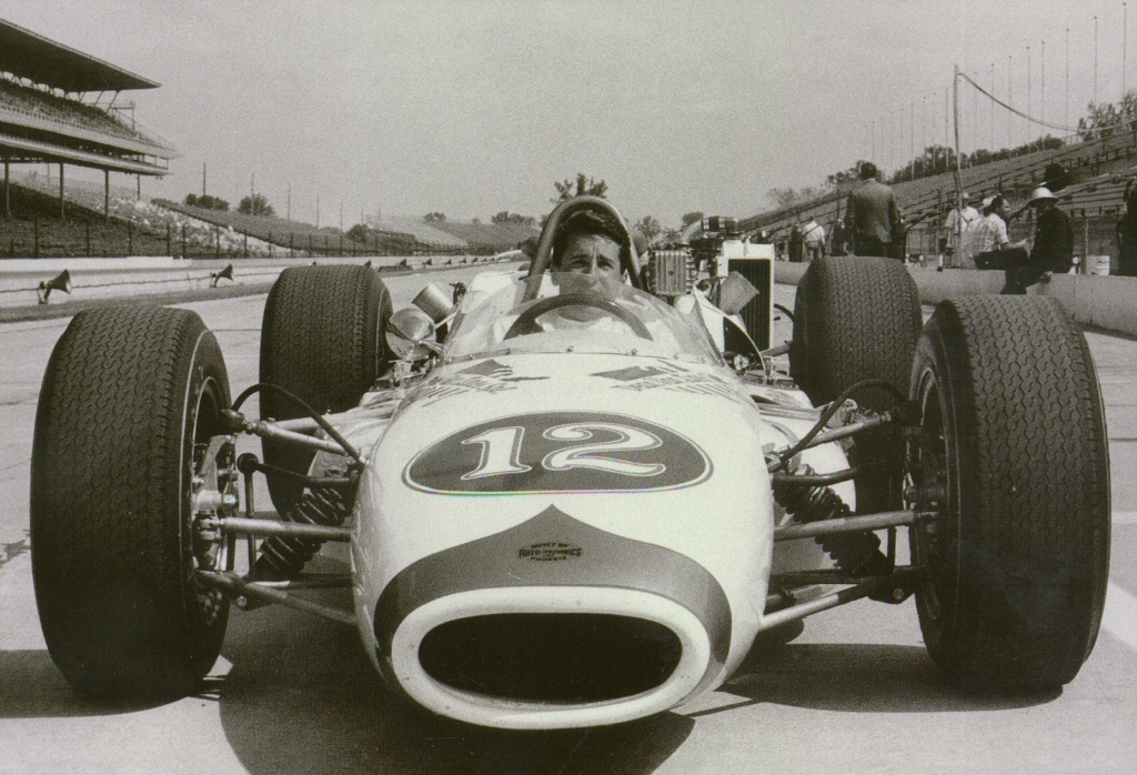 Mario Andretti in the car he drove to a 3rd place finish in the 65 Indy 500 as a rookie