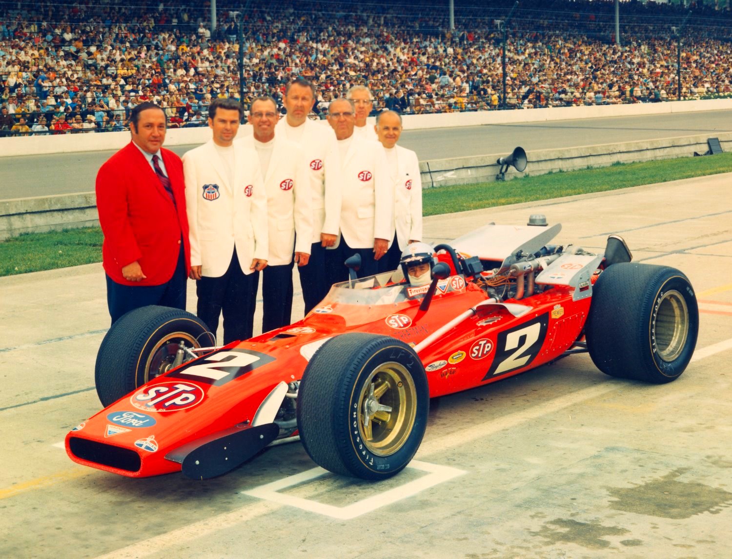 Mario Andretti with Jim McGee and Clint Brawner after qualifying for the Indy 500