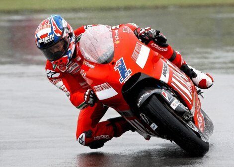Stoner takes pole in wet at Donington