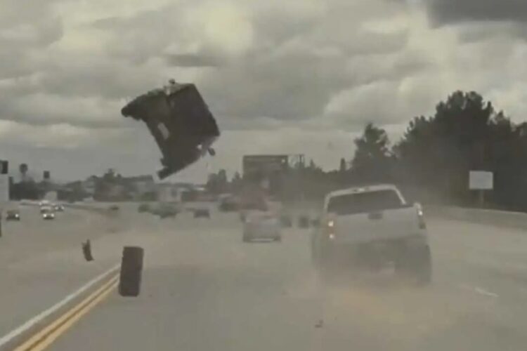 Automotive: Kia Soul Goes Airborne After Smashing Into Runaway Wheel