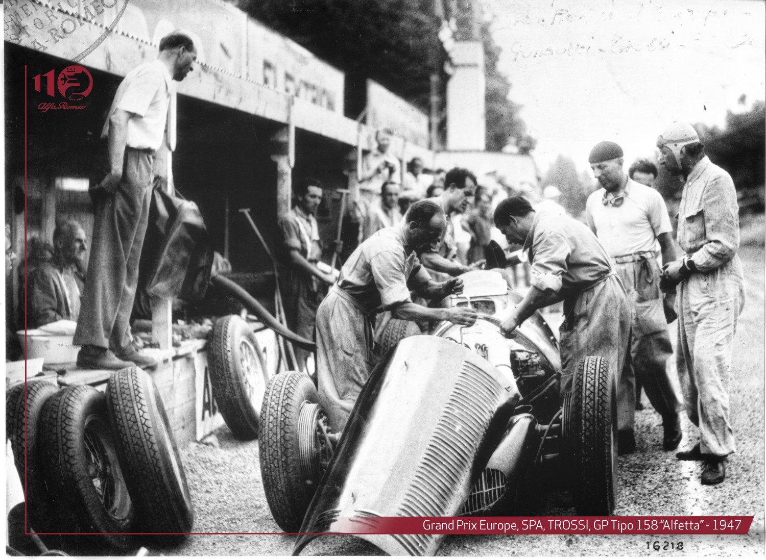 1947 Trossi in the Spa pits while mechanics work on his Alfa Romeo