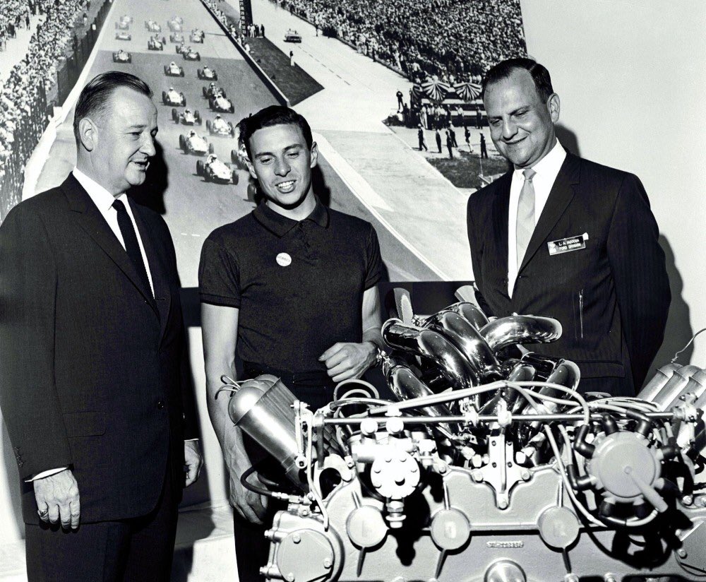Benson Ford, Jim Clark and Lee Iacocca check out the Ford dual overhead cam Indianapolis 500 engine